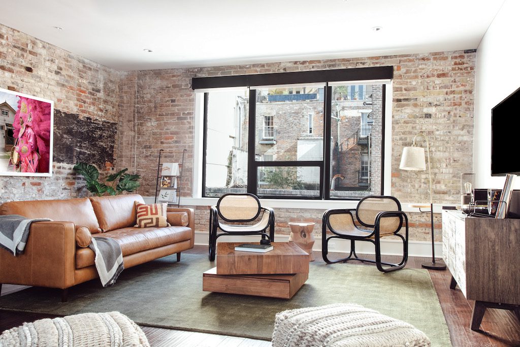 An Air BnB Interior with Brick Walls and a Glass Window