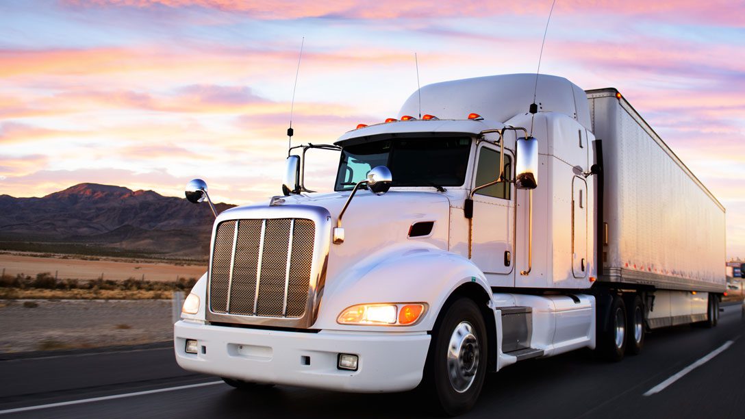A white freight truck - one of the assets you keep track of in logistics outsourcing