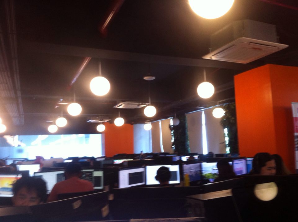 A BPO Office with Computer Monitors and Orange Walls