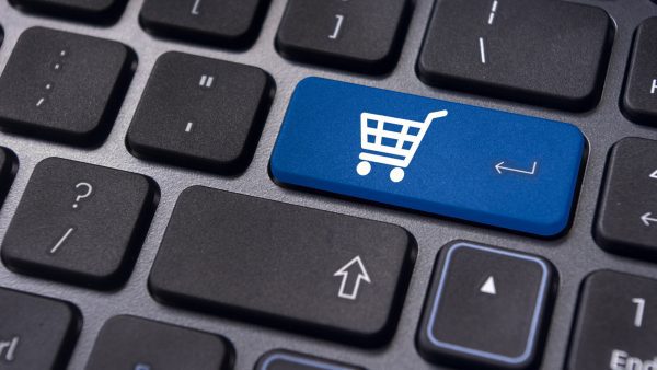 Shopping cart icon an a keyboard an essential icon of ecommerce