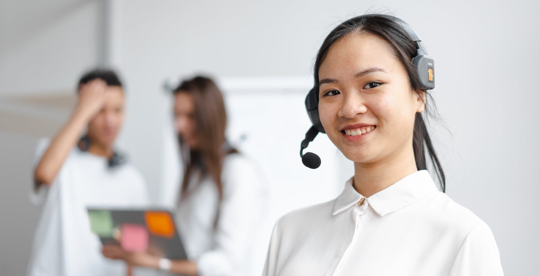 female outsource customer service agent with headset