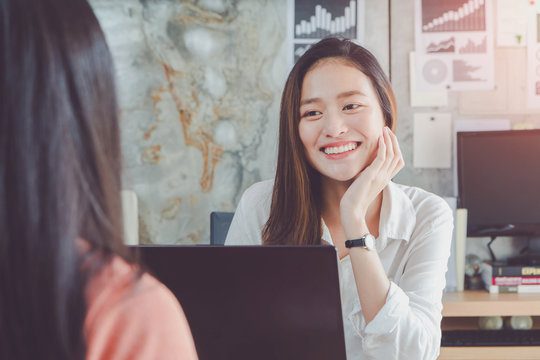 smiling female employee in an interview